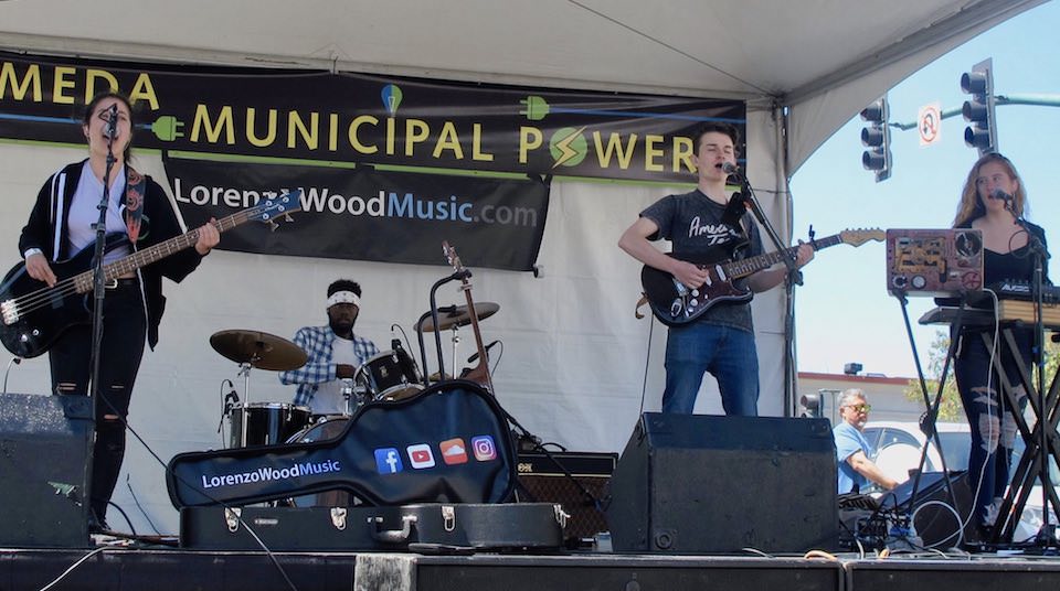 Lorenzo Wood and band performing at a street festival in Alameda, CA, in 2018